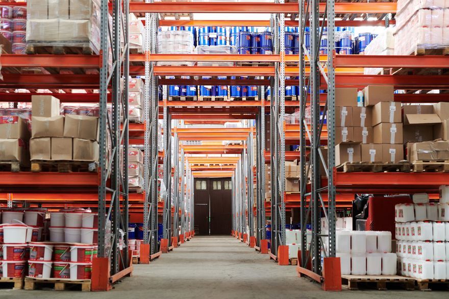 Warehouse aisle stocked with industrial supplies on pallet racking